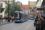 Kraków tram line 8 with low-floor articulated tram 2036 at Plac Wszystkich Świętych (2011)