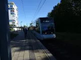 Aarhus light rail line L1 with low-floor articulated tram 2102-2202 at Løgten (2022)