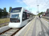 Aarhus light rail line L1 with low-floor articulated tram 2111-2211 at Ryomgård (2020)