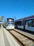 Aarhus light rail line L2 with low-floor articulated tram 1102-1202 at Gl. Skejby (2022)