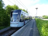 Aarhus light rail line L2 with low-floor articulated tram 1107-1207 at Rude Havvej  seen from behind (2021)