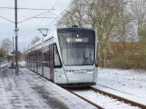 Aarhus light rail line L2 with low-floor articulated tram 1111-1211 at Tranbjerg (2021)