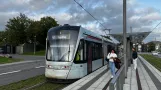 Aarhus light rail line L2 with low-floor articulated tram 1113-1213 at Nehrus Allé (2023)