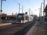 Barcelona tram line T4 with low-floor articulated tram 04 at Ca l'Aranyó (2015)