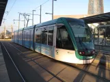 Barcelona tram line T4 with low-floor articulated tram 04, side view Ca l'Aranyó (2015)