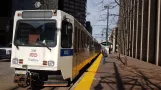 Denver tram line D with articulated tram 338 at 18th St / Stout Station (2020)