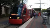 Houston tram line Red with low-floor articulated tram 117 at Dryden/TMC (2018)