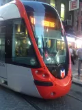 Istanbul regional line T1 with low-floor articulated tram 822 on Muradiye Cd (2014)