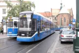 Kraków tram line 18 with articulated tram 183 on Plac Wszystkich Świętych (2011)