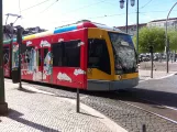 Lisbon tram line 15E with low-floor articulated tram 506 on Praça da Figueira (2013)