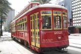 New Orleans line 48 Canal Streetcar with railcar 2021 on Canal street (2010)