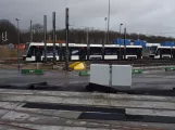 Odense low-floor articulated tram 04 "Strømmen" on the side track at Kontrol centret (2020)