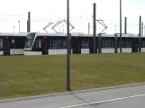 Odense low-floor articulated tram 11 "Hjemkomsten" in front of Kontrol centret (2022)