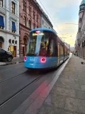 Oslo low-floor articulated tram 403 outside Prinsens gate 7-9 (2022)