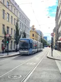 Oslo tram line 13 with low-floor articulated tram 146 at Dronningens gate (2021)