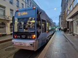 Oslo tram line 13 with low-floor articulated tram 157 at Dronningens gate (2024)