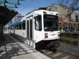 Portland regional line Blue with articulated tram 110 at Orenco (2016)