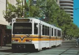 Postcard: Sacramento tram line Yellow with articulated tram 119 on O Street (1987)