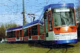 Puzzle: Darmstadt low-floor articulated tram 9858 at Böllenfalltor (2003)