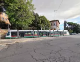 Rome tram line 3 with low-floor articulated tram 9218 on Viale Aventino, seen from the side (2020)