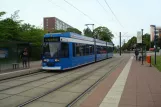 Rostock extra line 4 with low-floor articulated tram 654 at Warnowallee (2011)