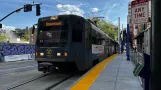 Sacramento tram line Blue with articulated tram 240 at 8th & K Station (NB) (2024)