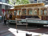 San Francisco cable car Powell-Hyde with cable car 28 at Powell & Market  seen from the side (2009)