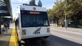 Santa Clara regional line Green 902 with low-floor articulated tram 996 at Civic Center (2018)