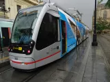 Seville tram line T1 with low-floor articulated tram 303 at Archivo de Indias (2023)