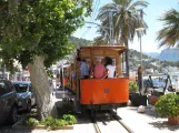 Sóller tram line with open sidecar 10 on Carrer de la Marina, seen from behind (2013)