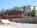 Sóller tram line with railcar 20 on Carrer de la Marina, seen from the side (2013)
