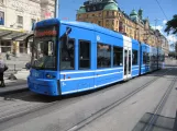 Stockholm tram line 7S Spårväg City with low-floor articulated tram 5 on Nybroplan (2015)