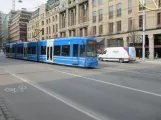 Stockholm tram line 7S Spårväg City with low-floor articulated tram 6 in front of NK, Hamngaten (2019)
