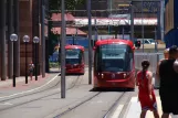 Sydney light rail line L1 with low-floor articulated tram 2112 on Darling Dr (2014)