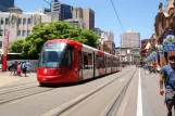Sydney light rail line L1 with low-floor articulated tram 2117 on Hay Street, Darling Harbour (2014)