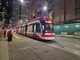 Toronto low-floor articulated tram 4411 at King St West at Bay St West Side (2023)