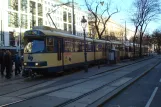 Vienna regional line 515 - Badner Bahn with articulated tram 4-115 "Andreas" at Oper (2014)