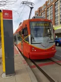 Washington, D.C. Streetcar with low-floor articulated tram 103 at H St & 3rd St Eastbound (2016)