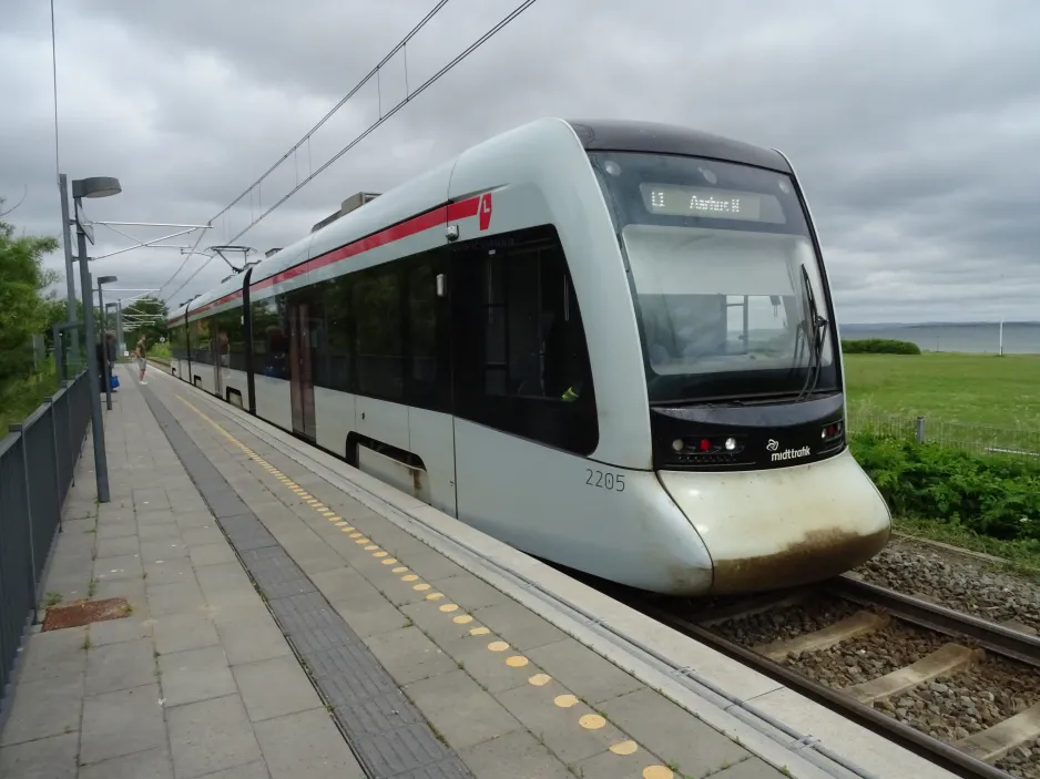 Aarhus light rail line L1 with low-floor articulated tram 2105-2205 at Risskov Strandpark (2024)