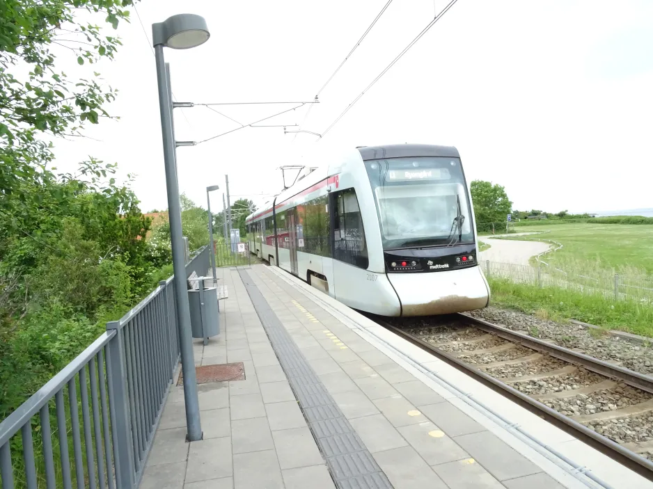 Aarhus light rail line L1 with low-floor articulated tram 2107-2207 at Risskov Strandpark (2024)