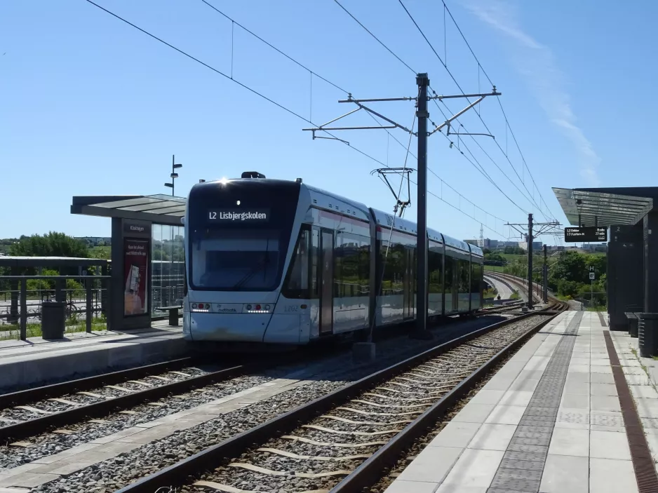 Aarhus light rail line L2 with low-floor articulated tram 1102-1202 at Klokhøjen  seen from behind (2020)