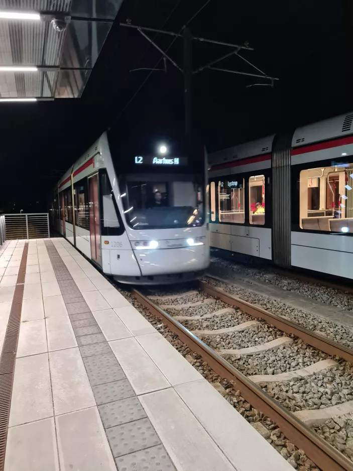 Aarhus light rail line L2 with low-floor articulated tram 1106-1206 at Gl. Skejby (2021)
