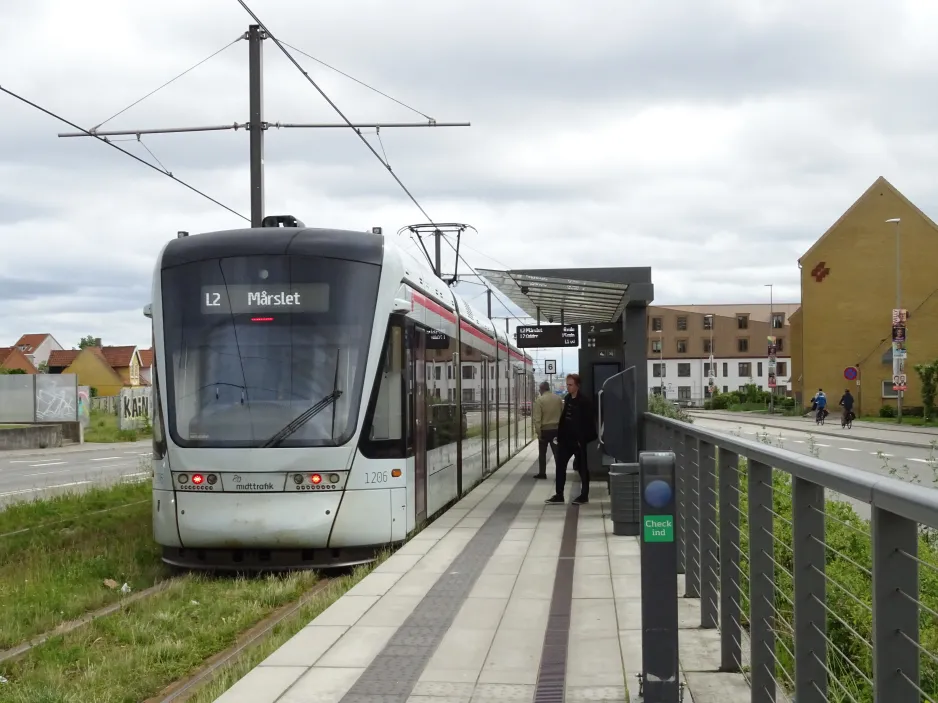 Aarhus light rail line L2 with low-floor articulated tram 1106-1206 at Stockholmsgade (2024)