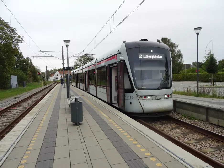 Aarhus light rail line L2 with low-floor articulated tram 1110-1210 at Tranbjerg (2023)