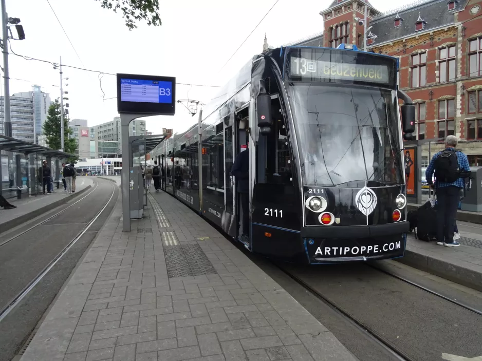 Amsterdam tram line 13 with low-floor articulated tram 2111 at Central Station (2022)