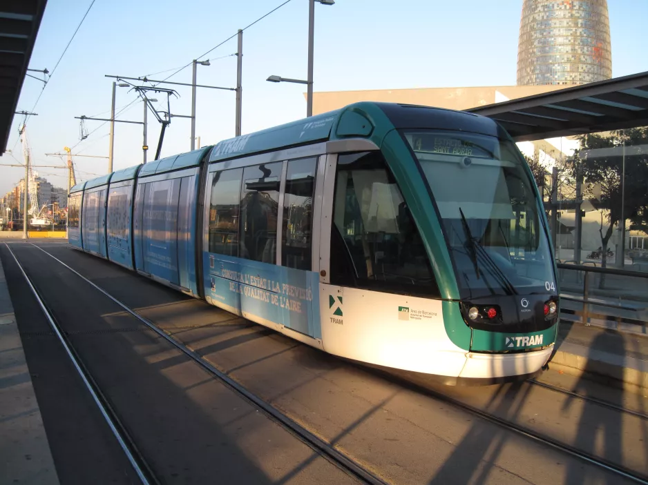 Barcelona tram line T4 with low-floor articulated tram 04, side view Ca l'Aranyó (2015)