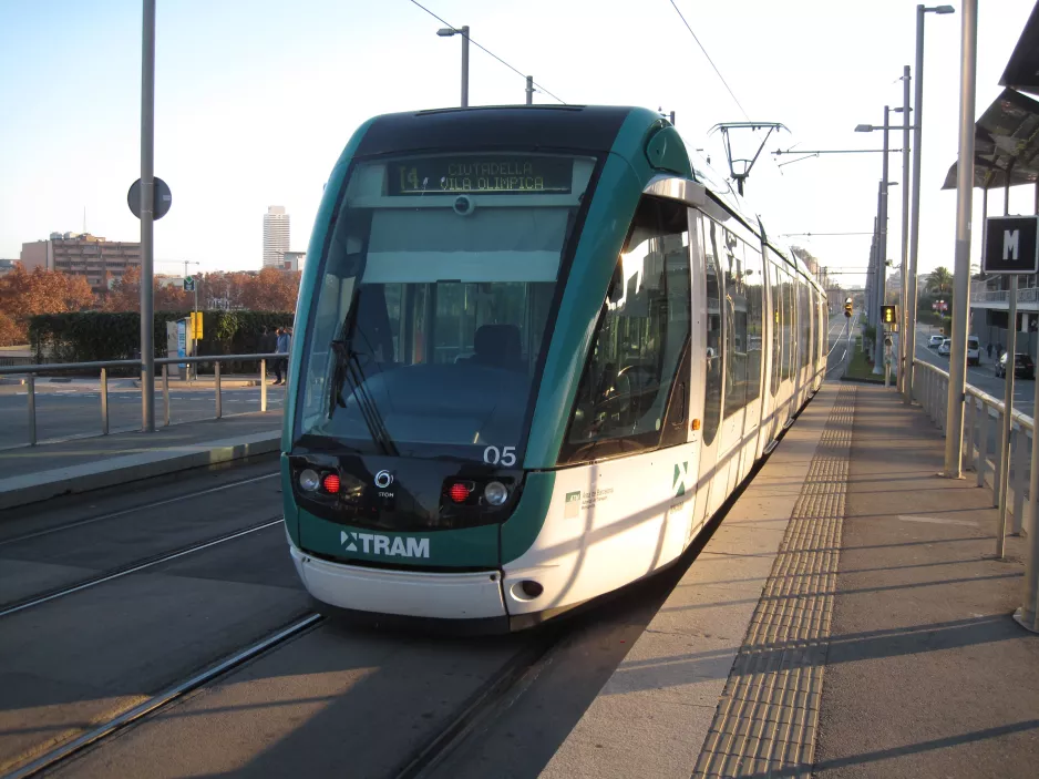 Barcelona tram line T4 with low-floor articulated tram 05 at Ca l'Aranyó front view (2015)