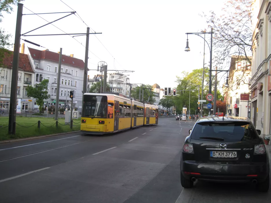 Berlin fast line M1 with low-floor articulated tram 1037 on Breite Strasse, Pankow (2016)