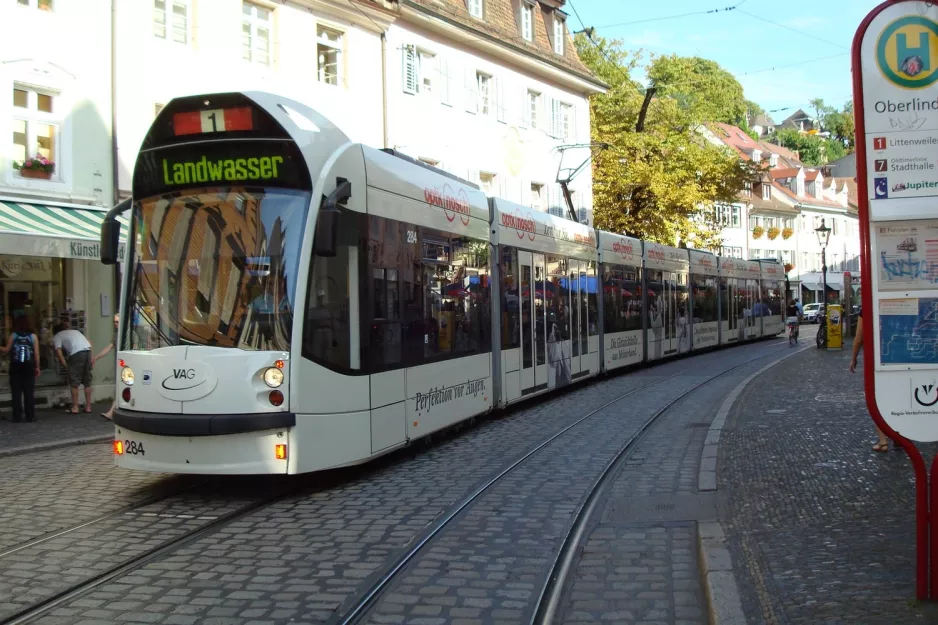 Freiburg im Breisgau tram line 1 with low-floor articulated tram 284 at Oberlinden (2008)