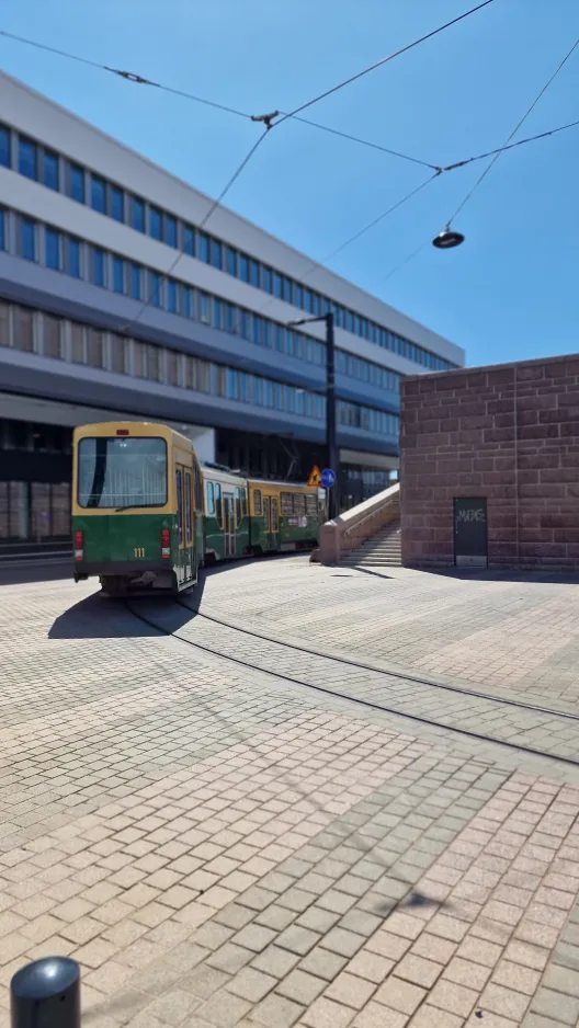 Helsinki tram line 9 with articulated tram 111 at Ilmalantori / Ilmalatorget (2024)